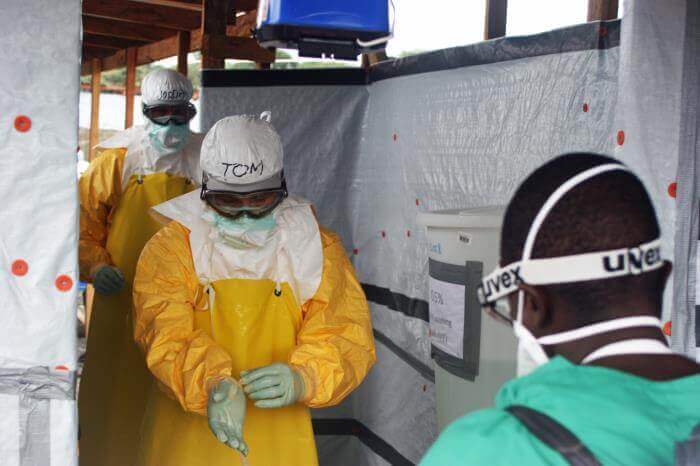CDC responders, including former director Dr. Tom Frieden, exit an Ebola treatment unit in Monrovia, Liberia, during the 2014 West African Ebola outbreak. Photo: Sally Ezra/CDC