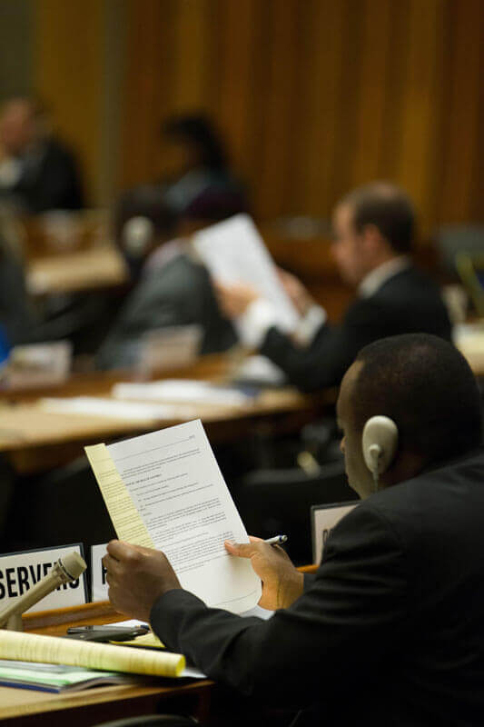 WHO delegates consider draft resolutions. Photo: Pierre Albouy/WHO