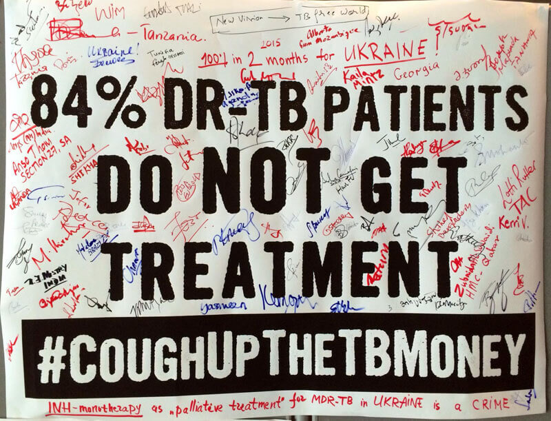 Conference participants signed posters with the rallying cry #CoughUptheTBMoney. Photo: Mike Frick/TAG