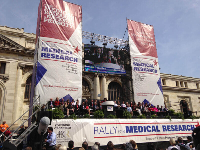 Thousands of scientists, patients, and research advocates gathered together on the grounds of the Carnegie Library in Washington, DC, on April 8 to unite behind a call for increased funding for medical research. Credit: Research!America
